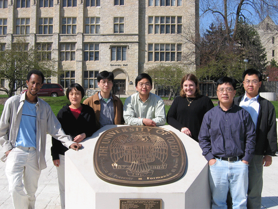Group picture, at university logo